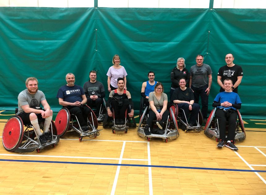 Group of people participating in wheelchair rugby through the NASA program